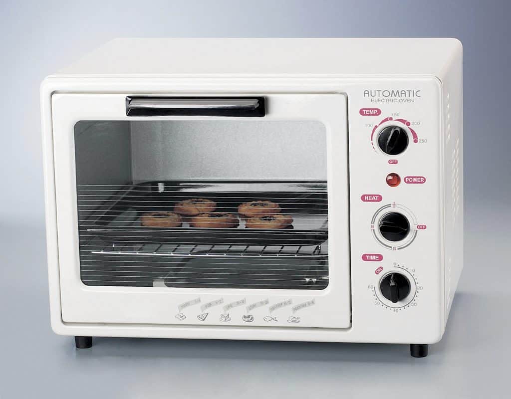 A toaster oven with a great toaster oven accessory! A cookie sheet pan for a toaster oven!
