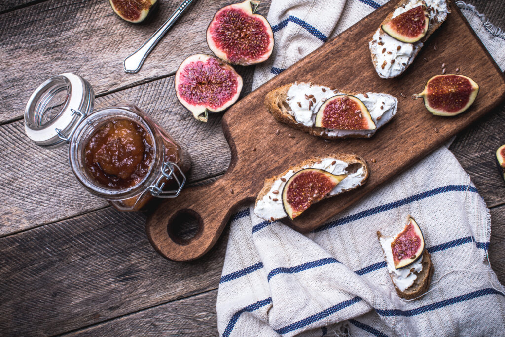 rustic style tasty Bruschetta with jam and figs on napkin