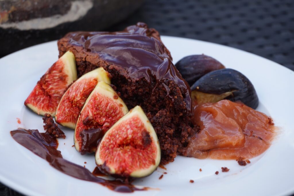 slice of chocolate cake with figs and fig substitute: apricots