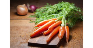 fresh carrots on a cutting board - Can You Freeze Cooked Carrots?