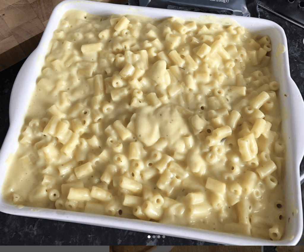 vegan mac and cheese in a ceramic baking dish